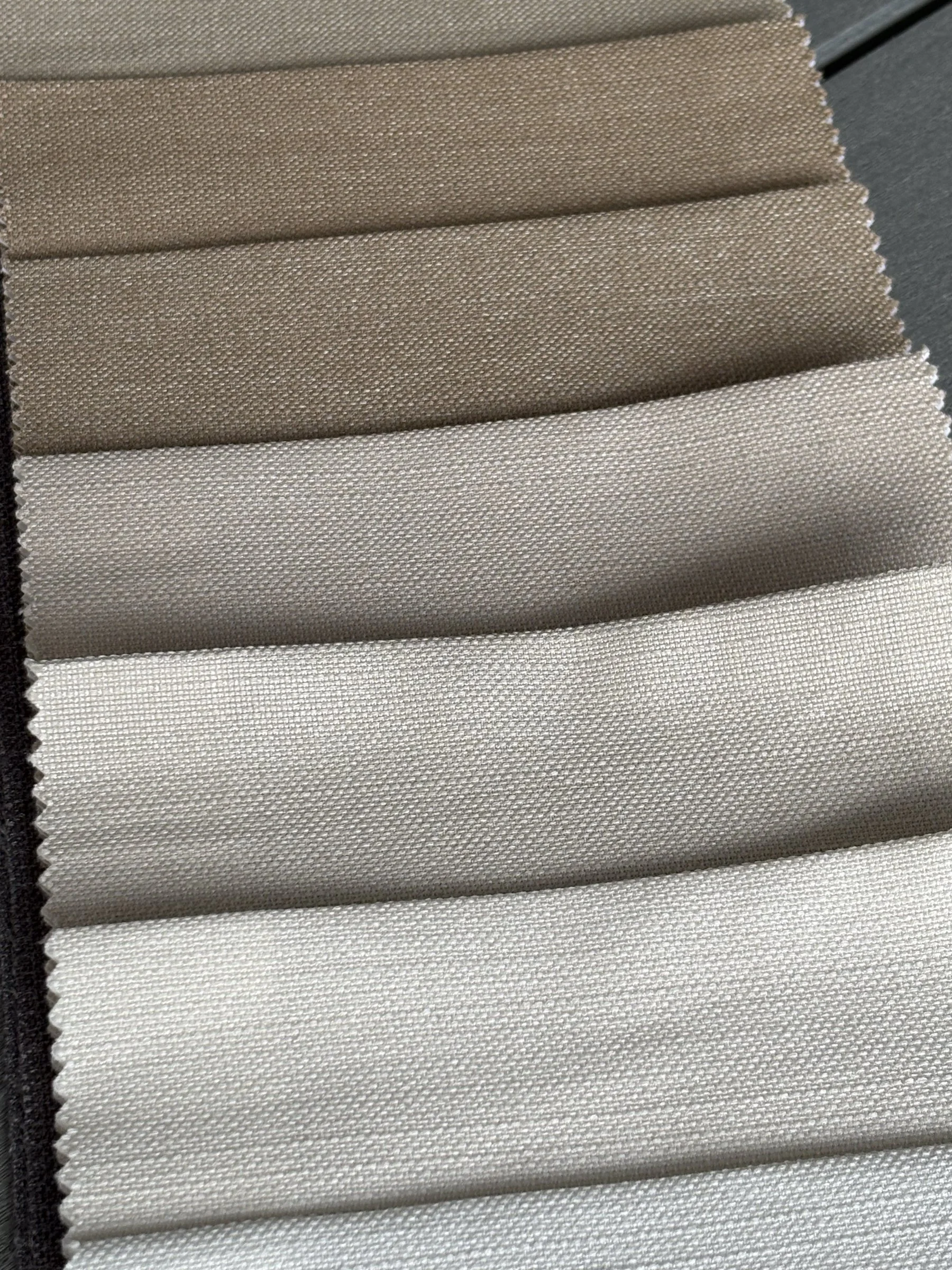 Close-up of woven linen fabric texture for custom curtains and Roman shades.