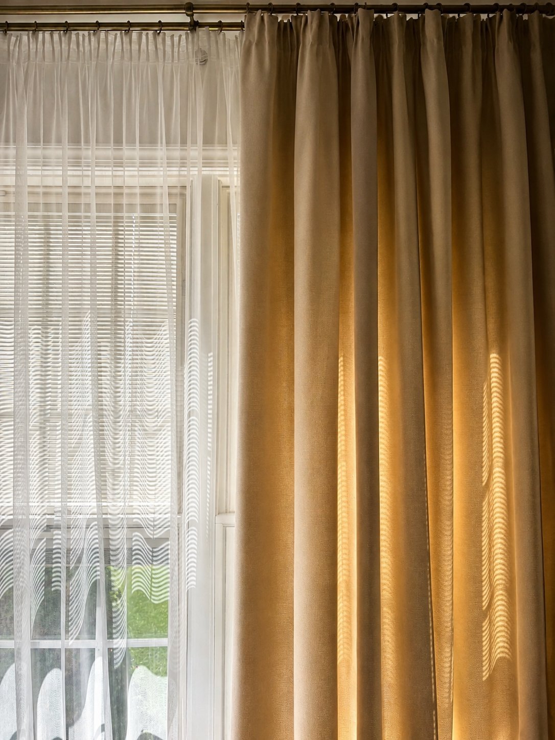 Soft neutral custom curtains filtering warm afternoon sunlight in a modern Pennsylvania home.