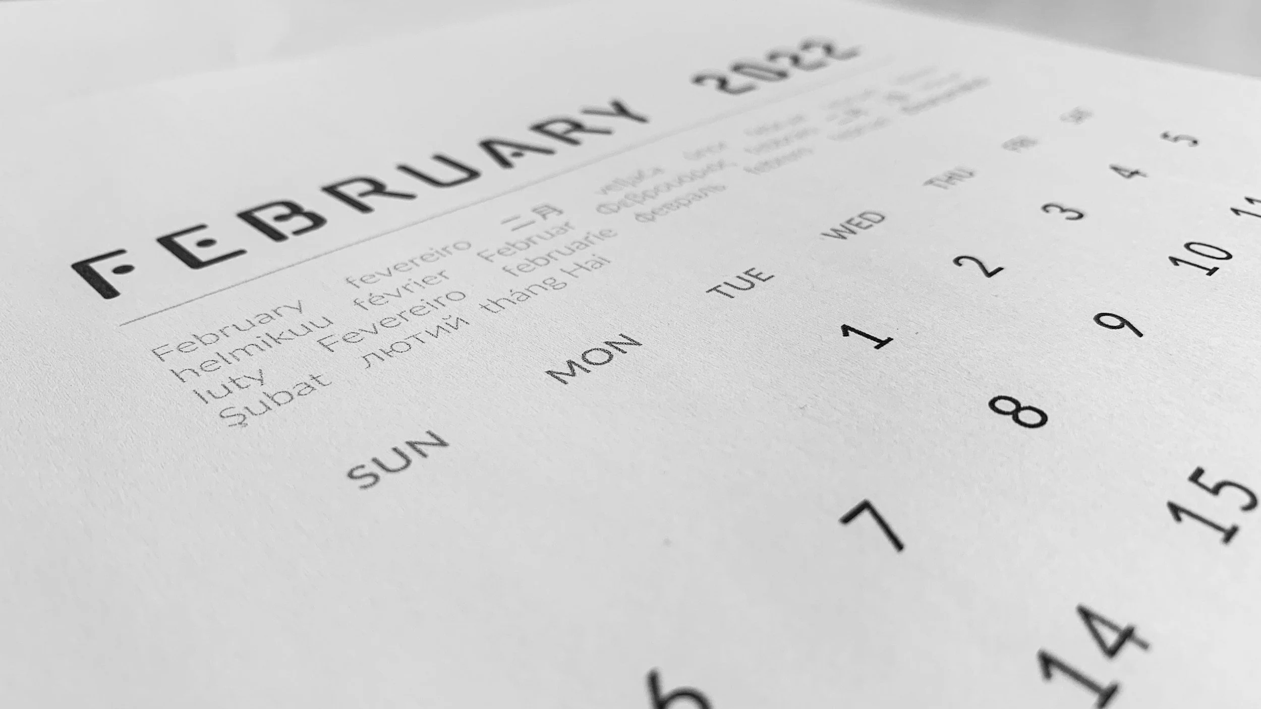 Close-up of a printed calendar page showing the month of February 2023, with the days of the week and dates visible, focusing on the dates March 5 to 11.