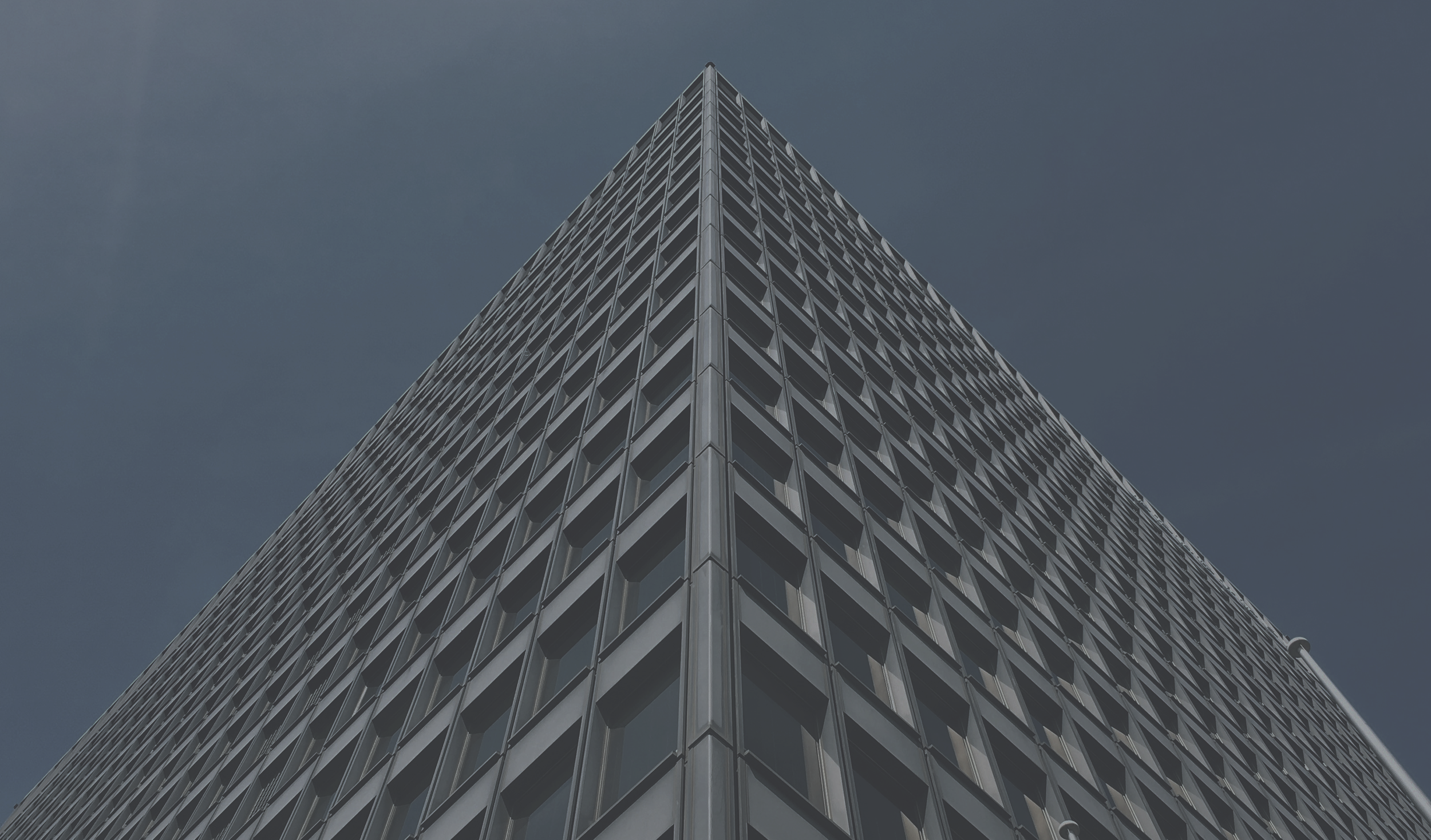 Modern office building representing organizational growth and operational excellence.