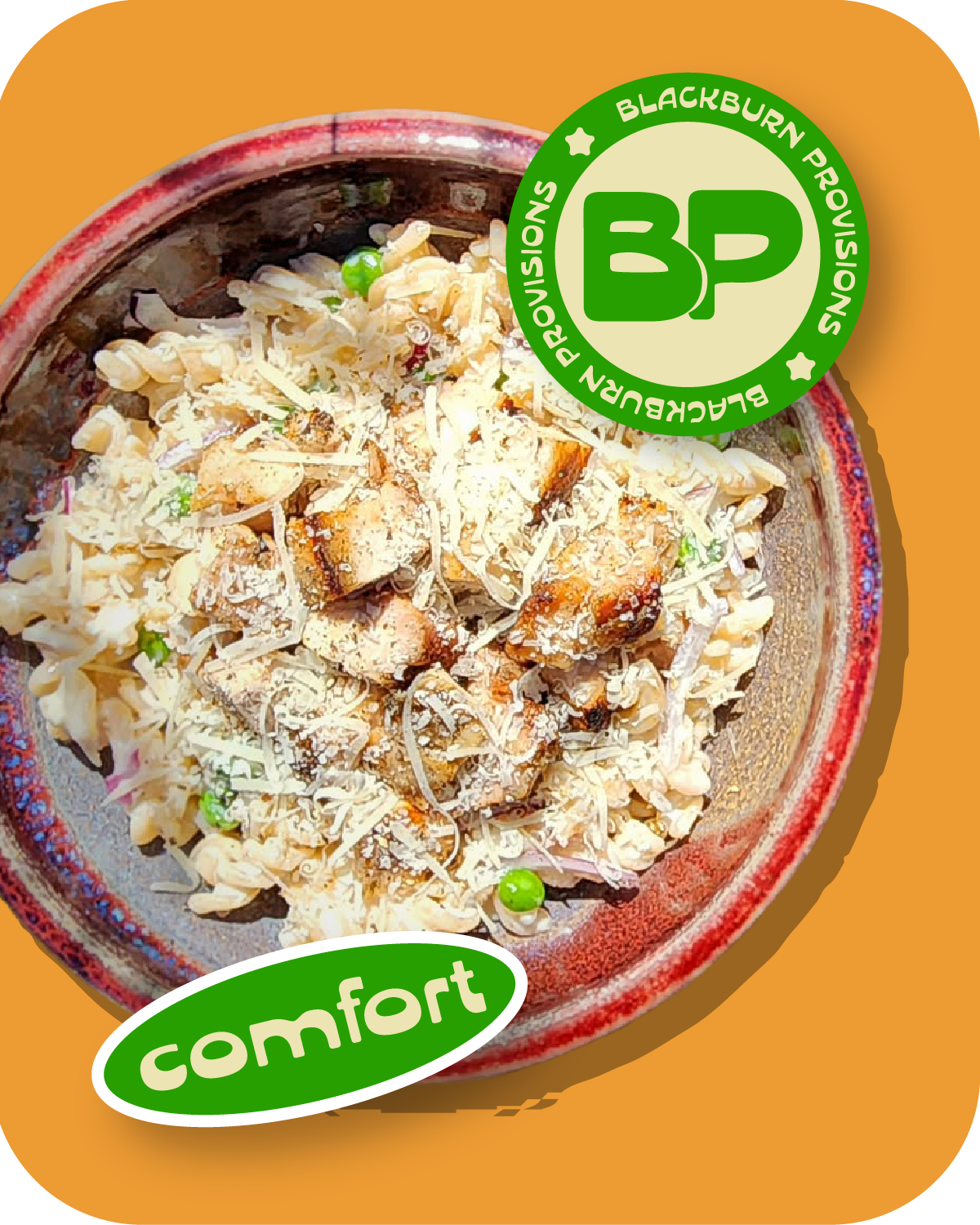 A bowl of salad with shredded cheese, croutons, peas, and chopped vegetables on a wooden table.