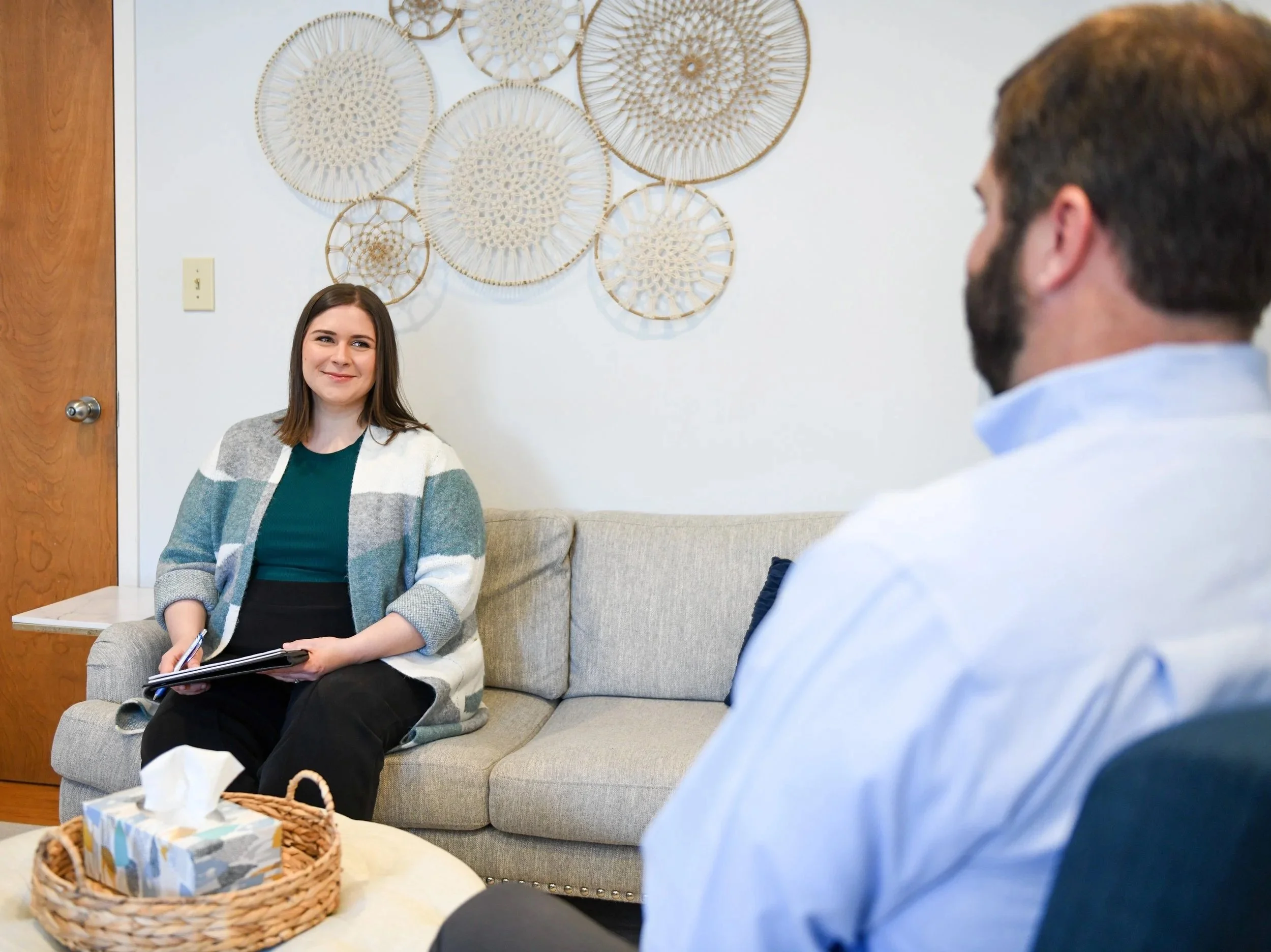 Image of an office consultation between one of our clinicians and a male client.