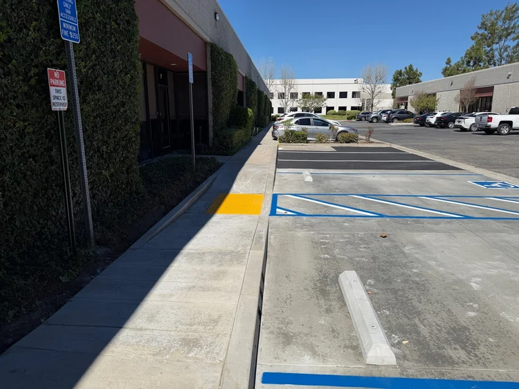 Reconstructed accessible parking stall and curb ramp