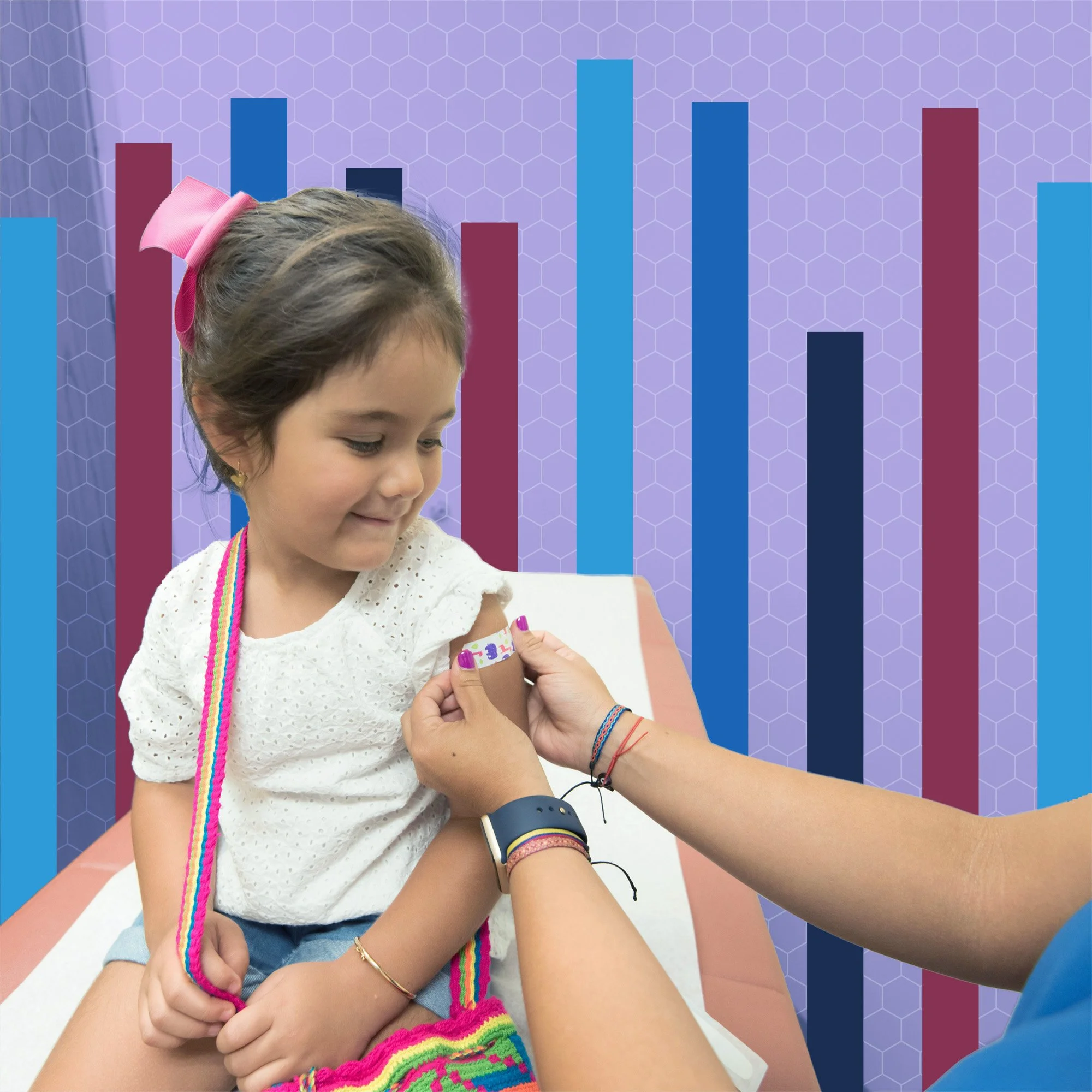 Young girl with a pink bow on her head smiling as she receives a vaccination in her arm, which is being injected by a healthcare professional in a clinical setting with a purple honeycomb-patterned background.