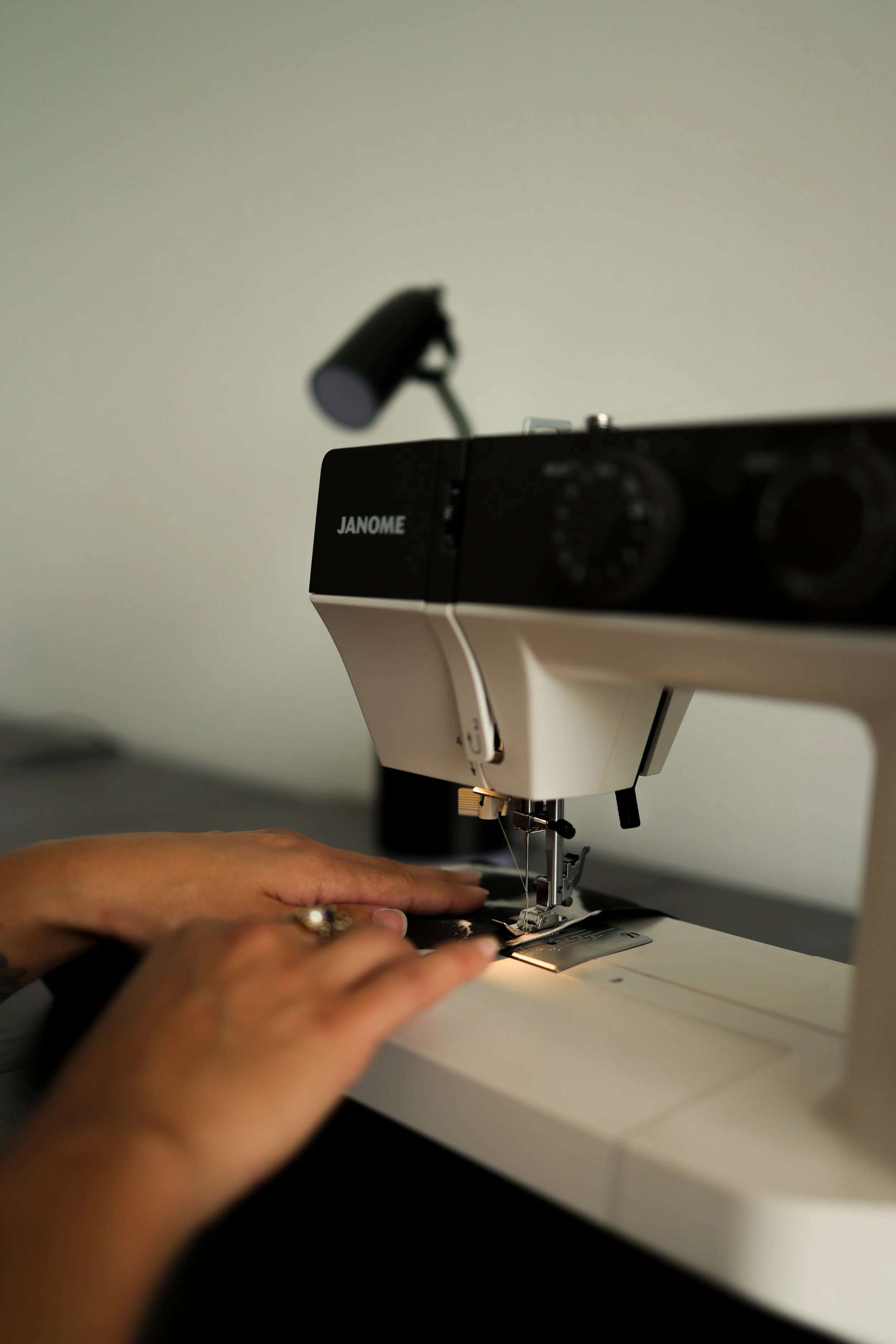 close+up+of+hands+at+sewing+machine.jpg