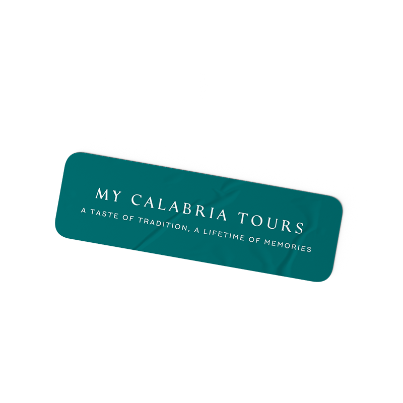 A green sign that reads 'My Calabria Tours' with the tagline 'A taste of tradition, a lifetime of memories'.