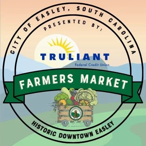 Logo for Truliant Farmers Market in Easley, South Carolina, featuring a sun, mountains, and a crate of vegetables.