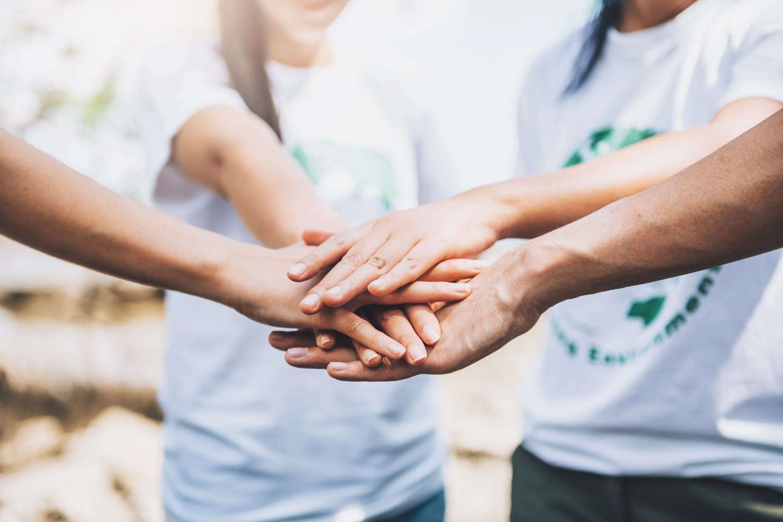 close-up-people-volunteer-teamwork-putting-finger-star-shapehands-togetherstack-handsunity-teamwork-world-environment-day.jpg