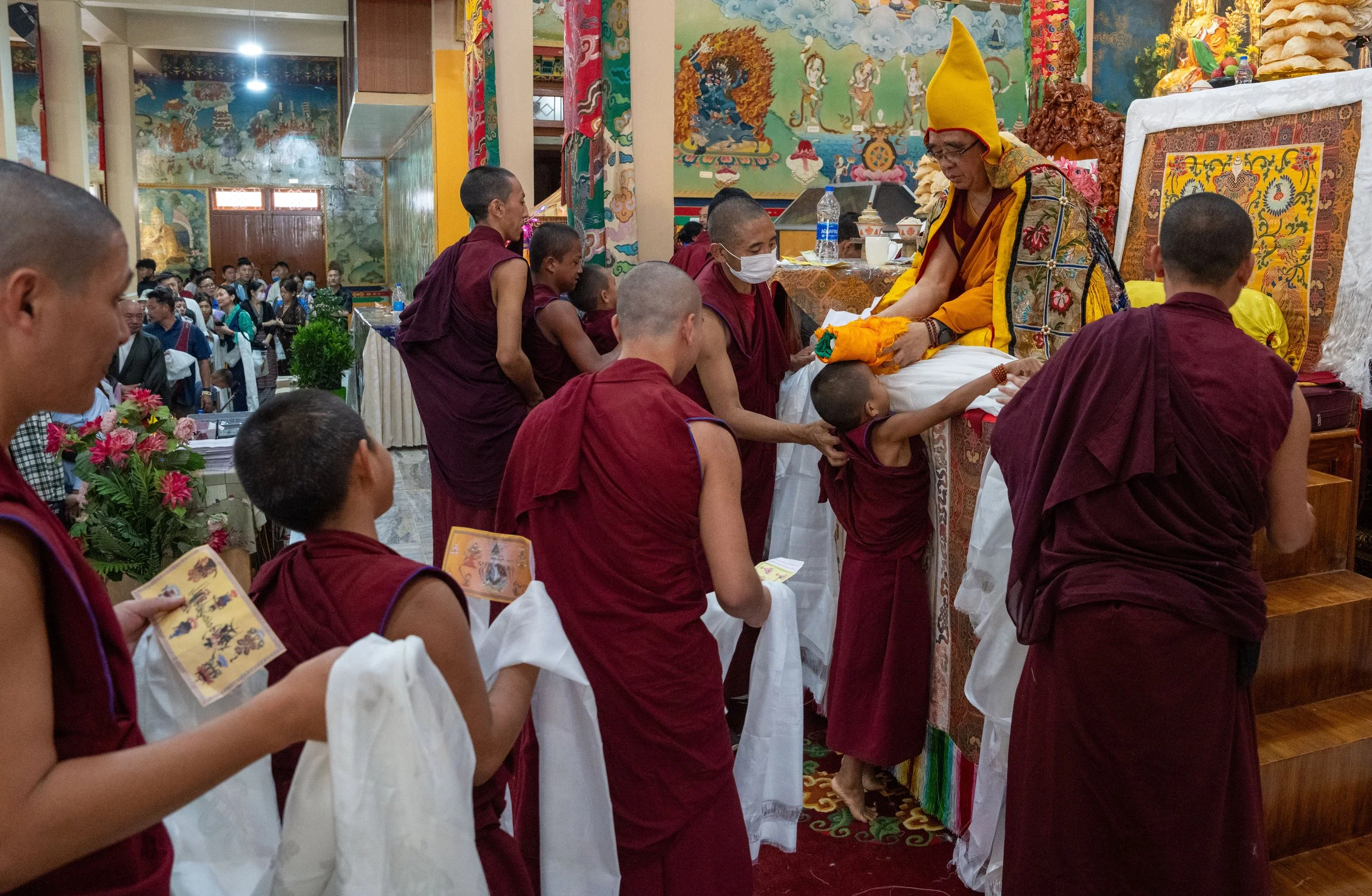 Monks wait in line at the Sera Jay Monastery for Losar Blessing 