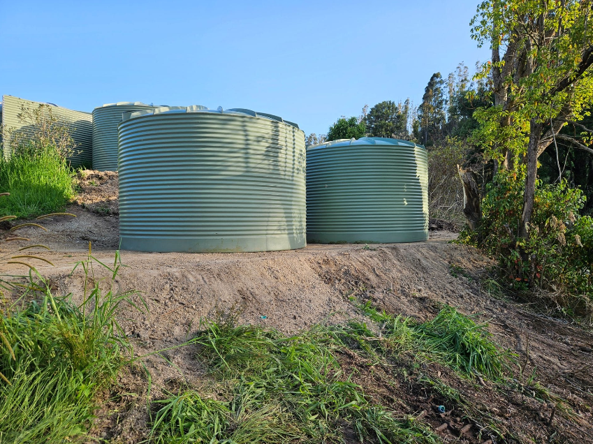 Tank Pad installation services, installing four tanks, installing 3 tanks, tank pads, tank pad building, installing a tank.