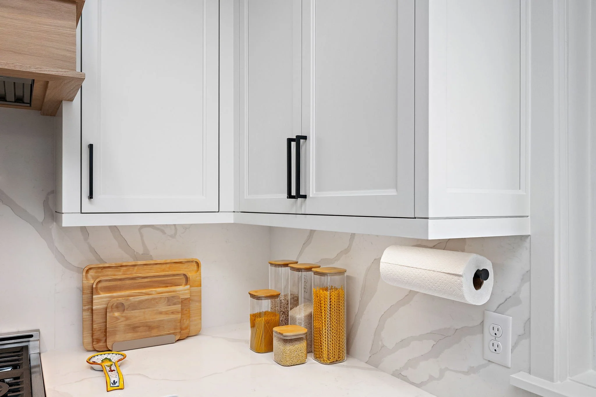 Quartz slab backsplash detail with wood
cutting boards, Minnetonka kitchen