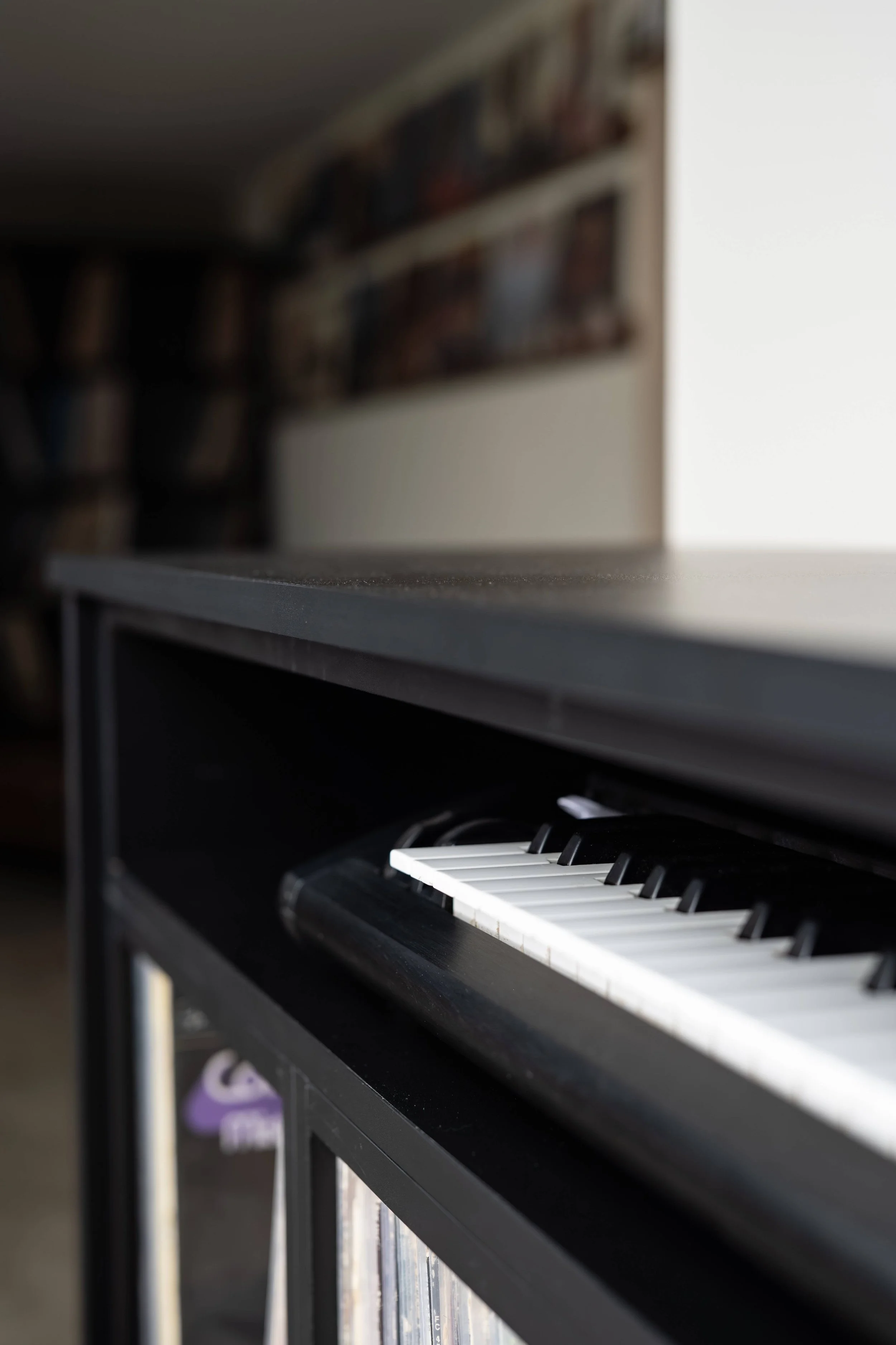 Black built-in cabinetry with keyboard station, Minneapolis basement remodel