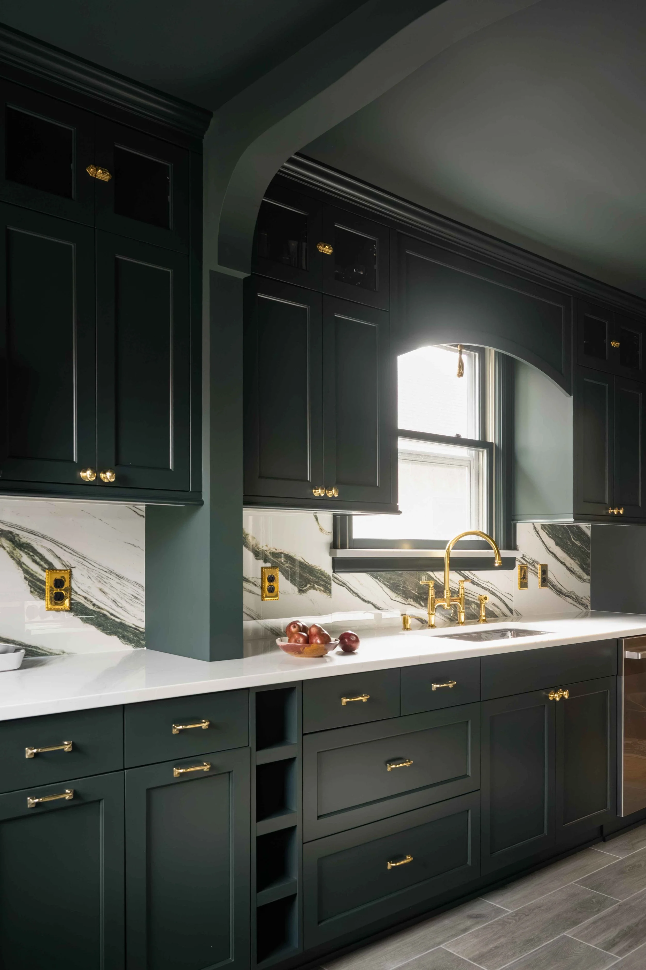 Kitchen sink wall with arched millwork and
ceramic tile backsplash, Minneapolis remodel