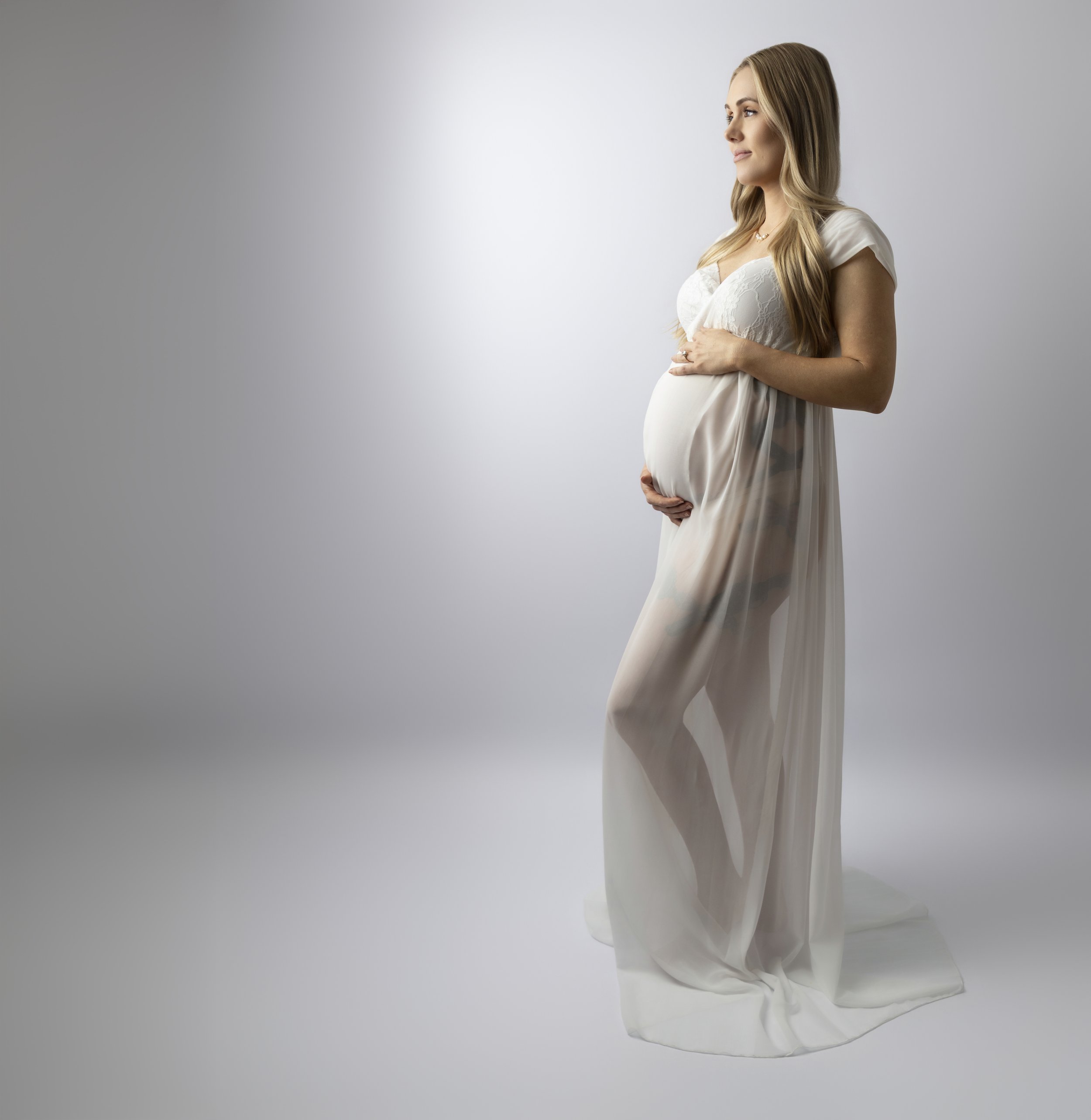 MATERNITY LADY HOLDING BELLY