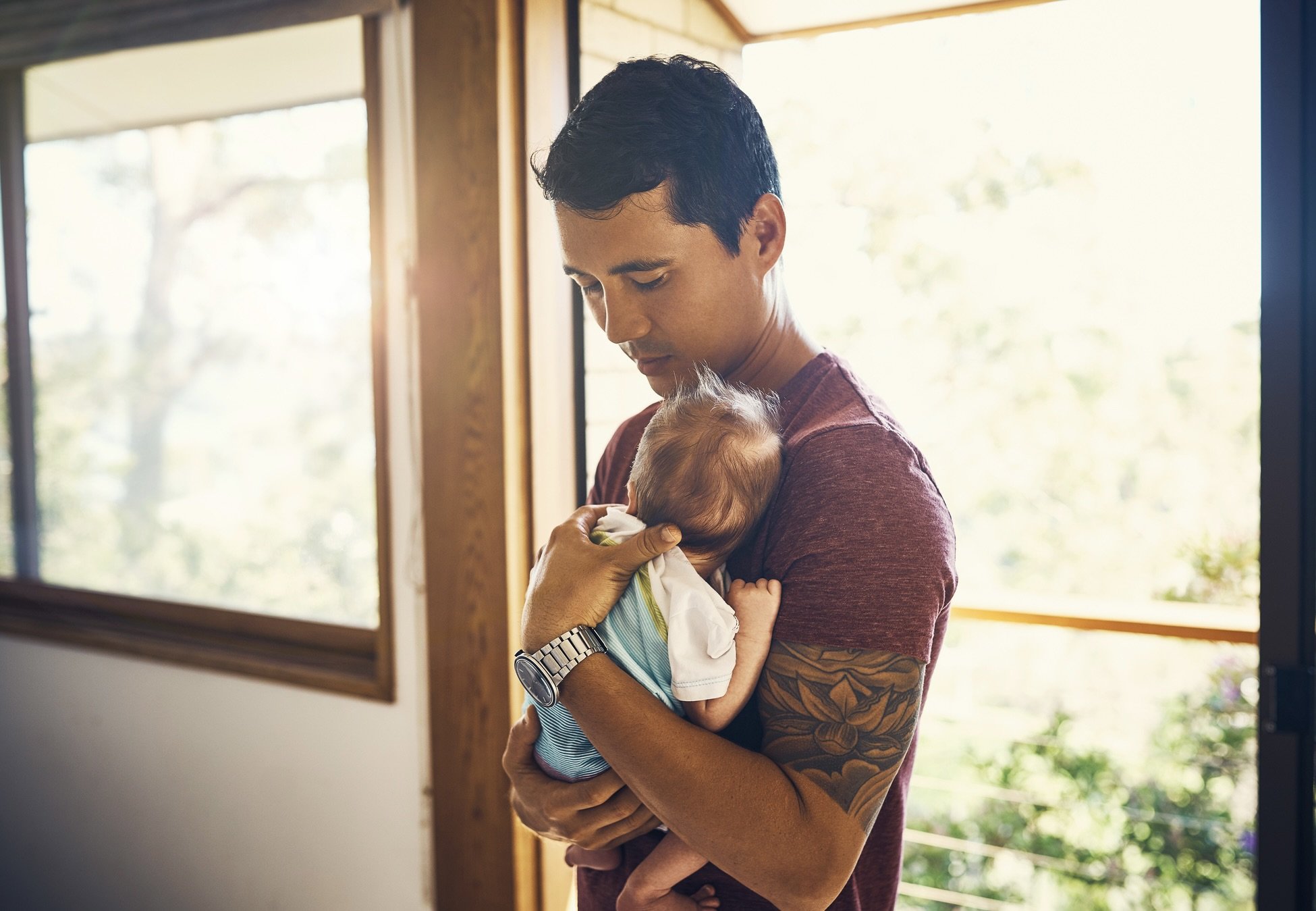 a new father holding his infant child