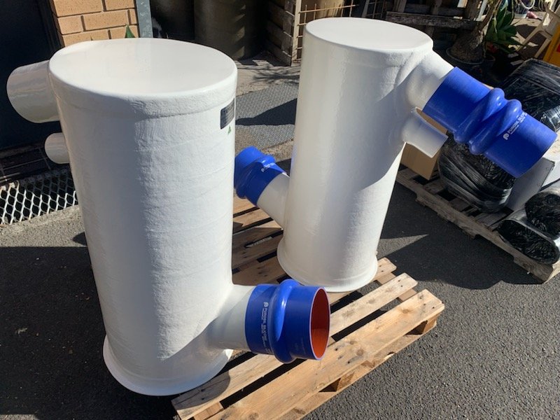 Large custom mufflers manufactured in premium vinyl ester composite for a commercial marine application.