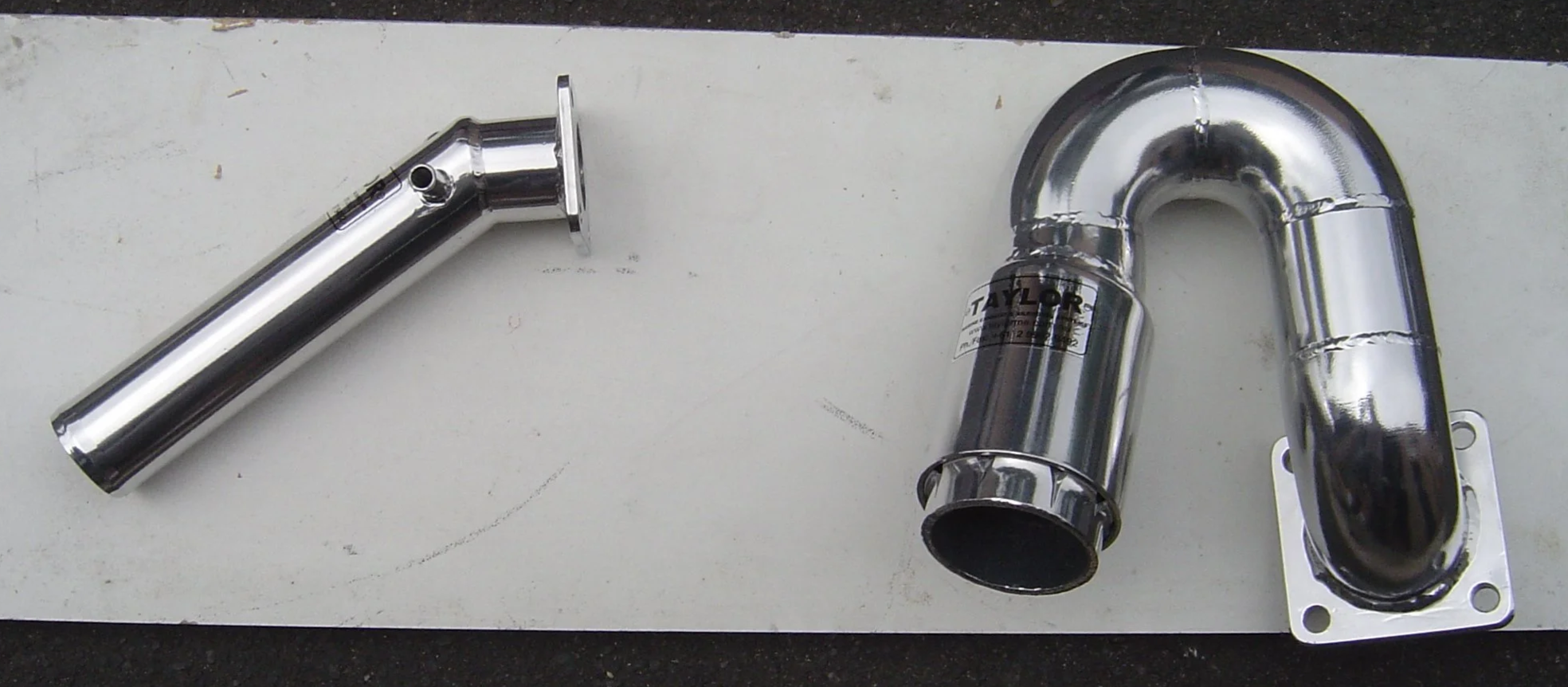 Polished stainless steel marine exhaust outlet manufactured by Taylor Marine Exhaust.