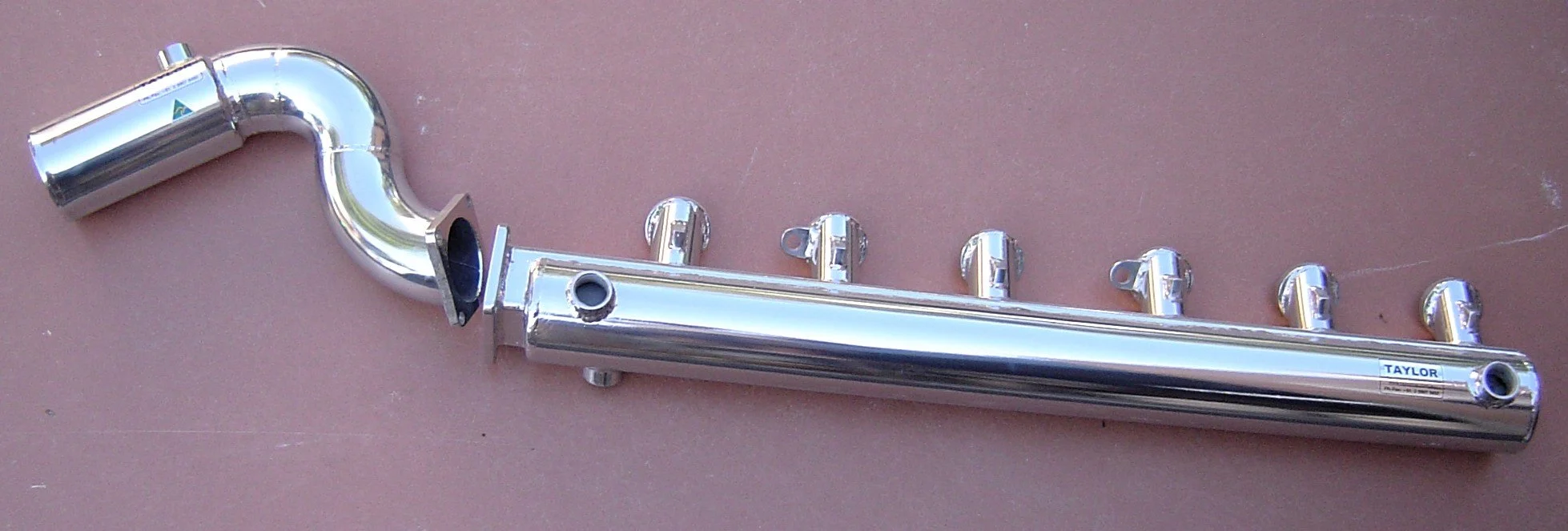 Custom stainless steel marine exhaust manifold fabricated by Taylor Marine Exhaust.