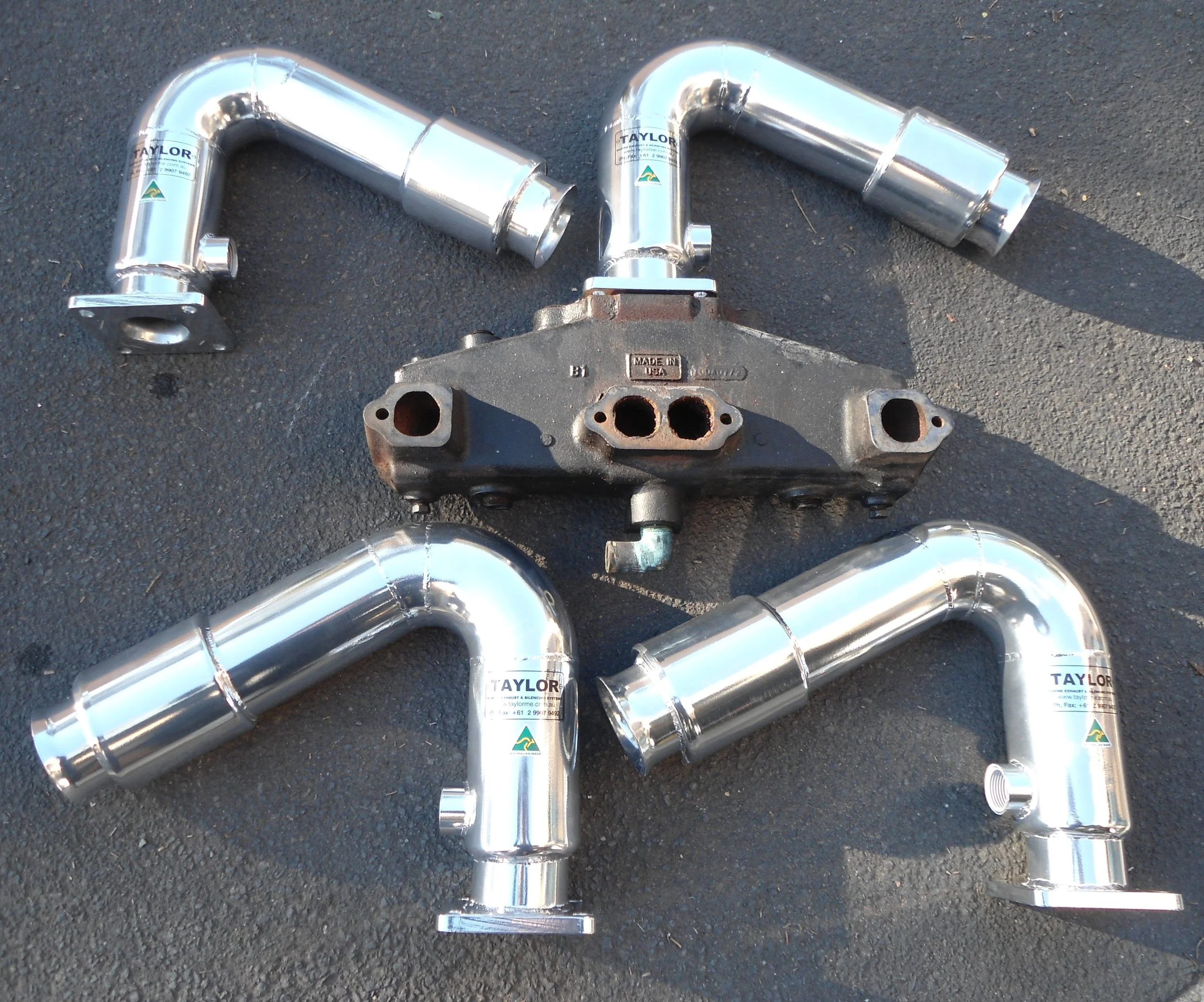 Stainless steel marine exhaust manifold assembly manufactured to custom specifications.