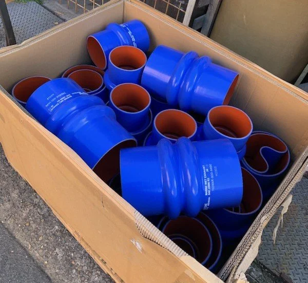 Marine-grade silicone hump hose supplied for vessel-specific exhaust installations.