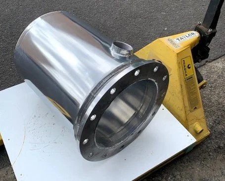 Custom stainless steel exhaust mixer fabricated for marine engine installations.