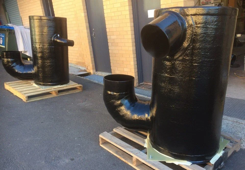 Marine exhaust separators manufactured from corrosion-resistant vinyl ester composite.
