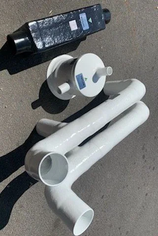 Custom vinyl ester exhaust fittings manufactured to suit unique vessel layout and engine installation requirements.
