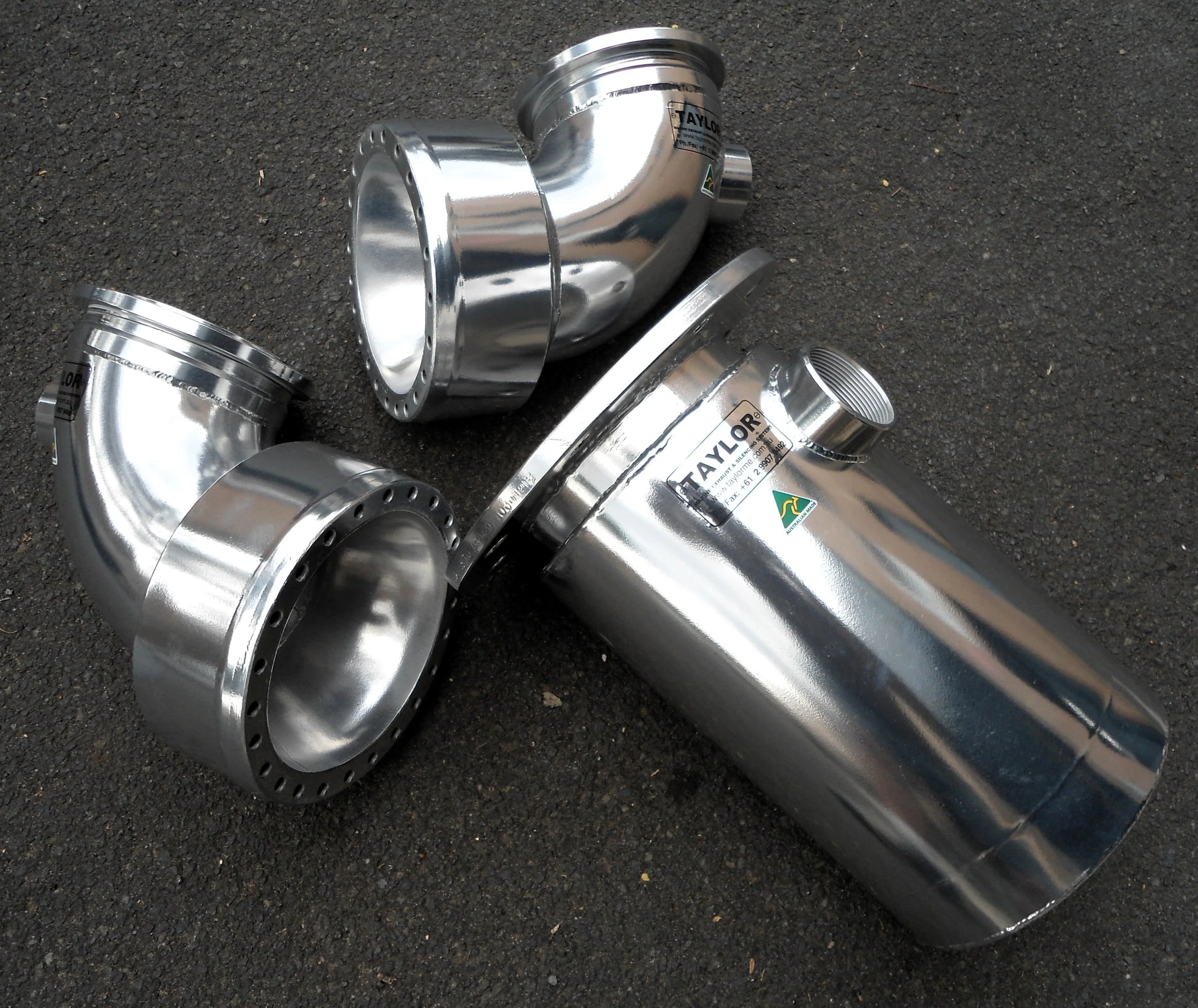 Marine-grade stainless steel exhaust elbows manufactured for wet exhaust applications.