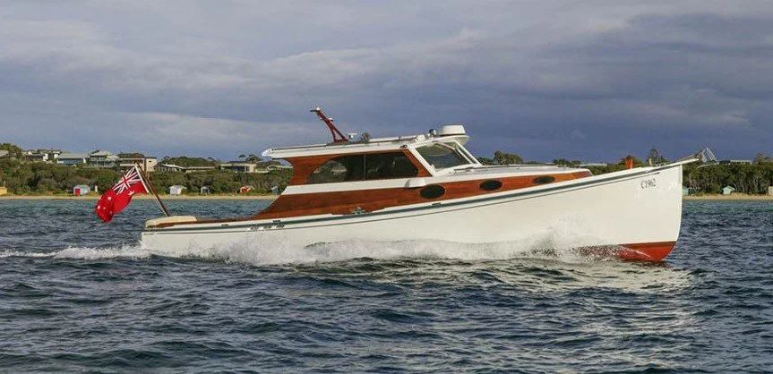 Taylor Marine Exhaust system supplied for a classic timber cruiser combining traditional craftsmanship with modern marine engineering.