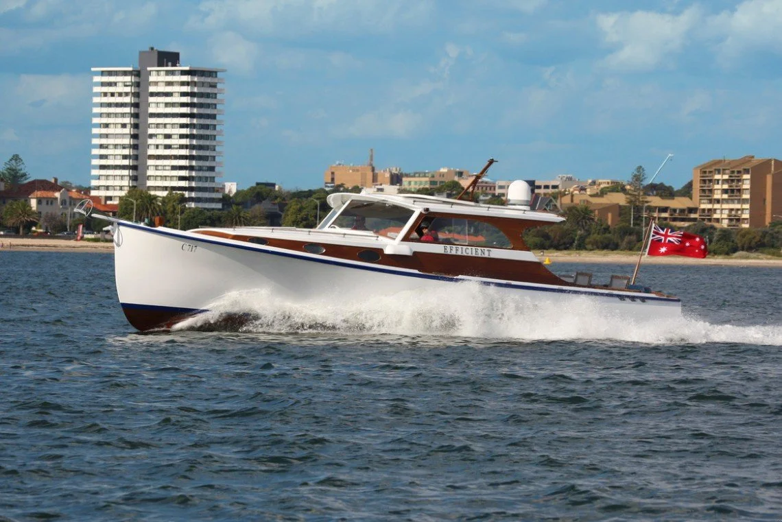 Taylor Marine Exhaust system supplied for a classic timber runabout combining traditional craftsmanship with modern marine engineering.
