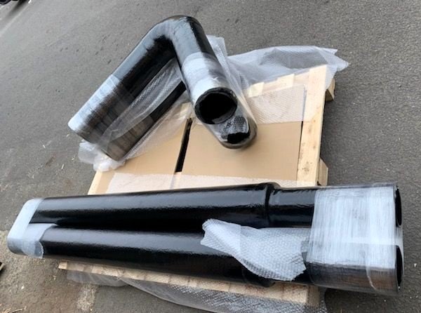 Custom vinyl ester exhaust bends manufactured for vessel-specific exhaust layouts.