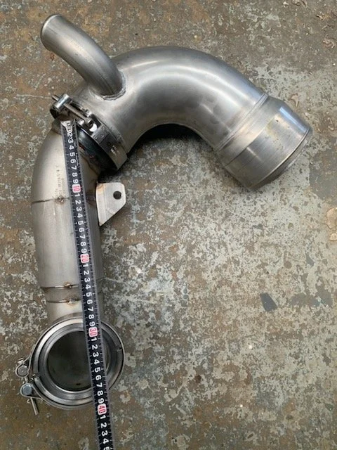 Marine-grade stainless steel exhaust elbow engineered for custom vessel layouts.
