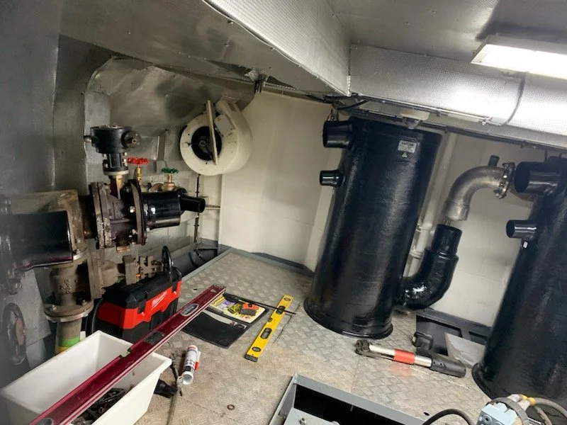 Engine room installation featuring a custom Taylor Marine Exhaust wet exhaust and silencing system.