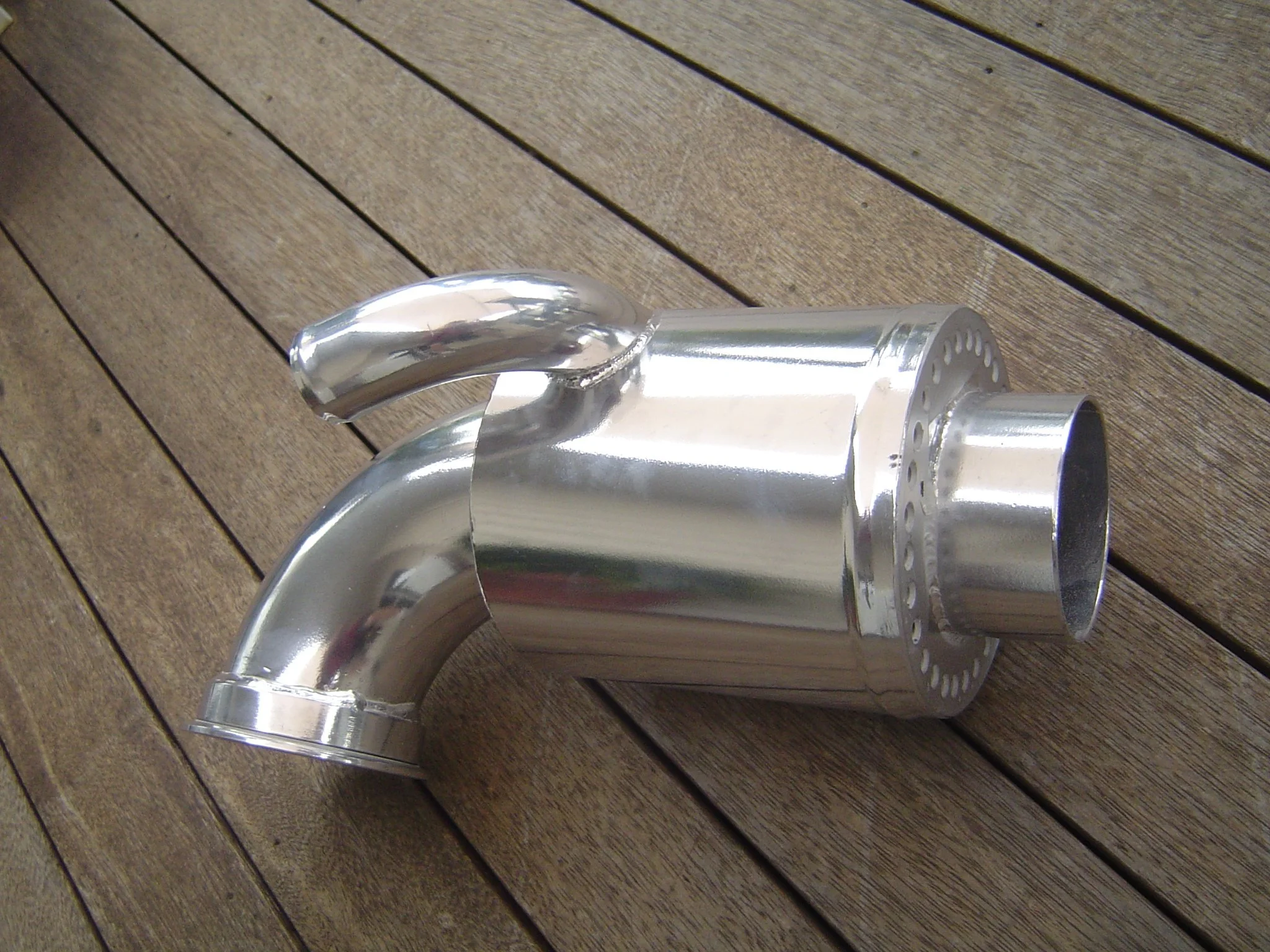 Custom stainless steel exhaust elbow fabricated for marine wet exhaust systems.