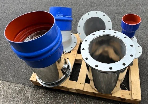 Marine exhaust components with silicone hose connections and stainless steel adaptors.