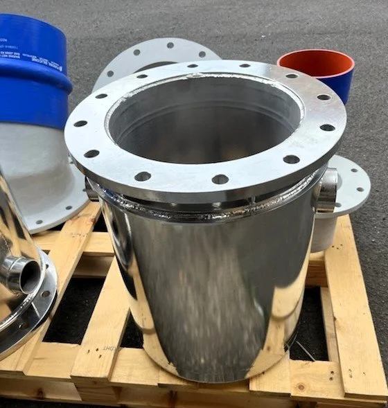 Custom stainless steel turbo flange exhaust fabrication manufactured by Taylor Marine Exhaust.