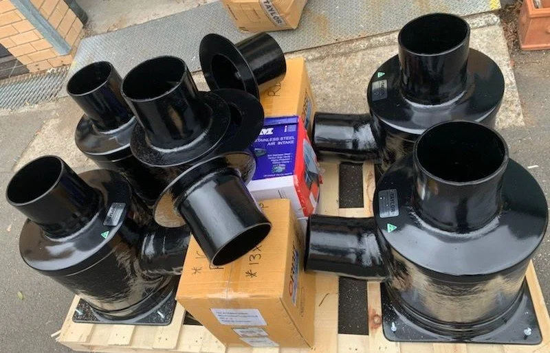 Custom vinyl ester wet exhaust fittings and vessel-specific exhaust components.
