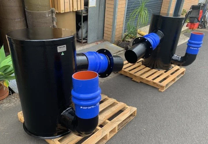 Custom exhaust assembly incorporating marine-grade hose connections manufactured for reliable long-term service.