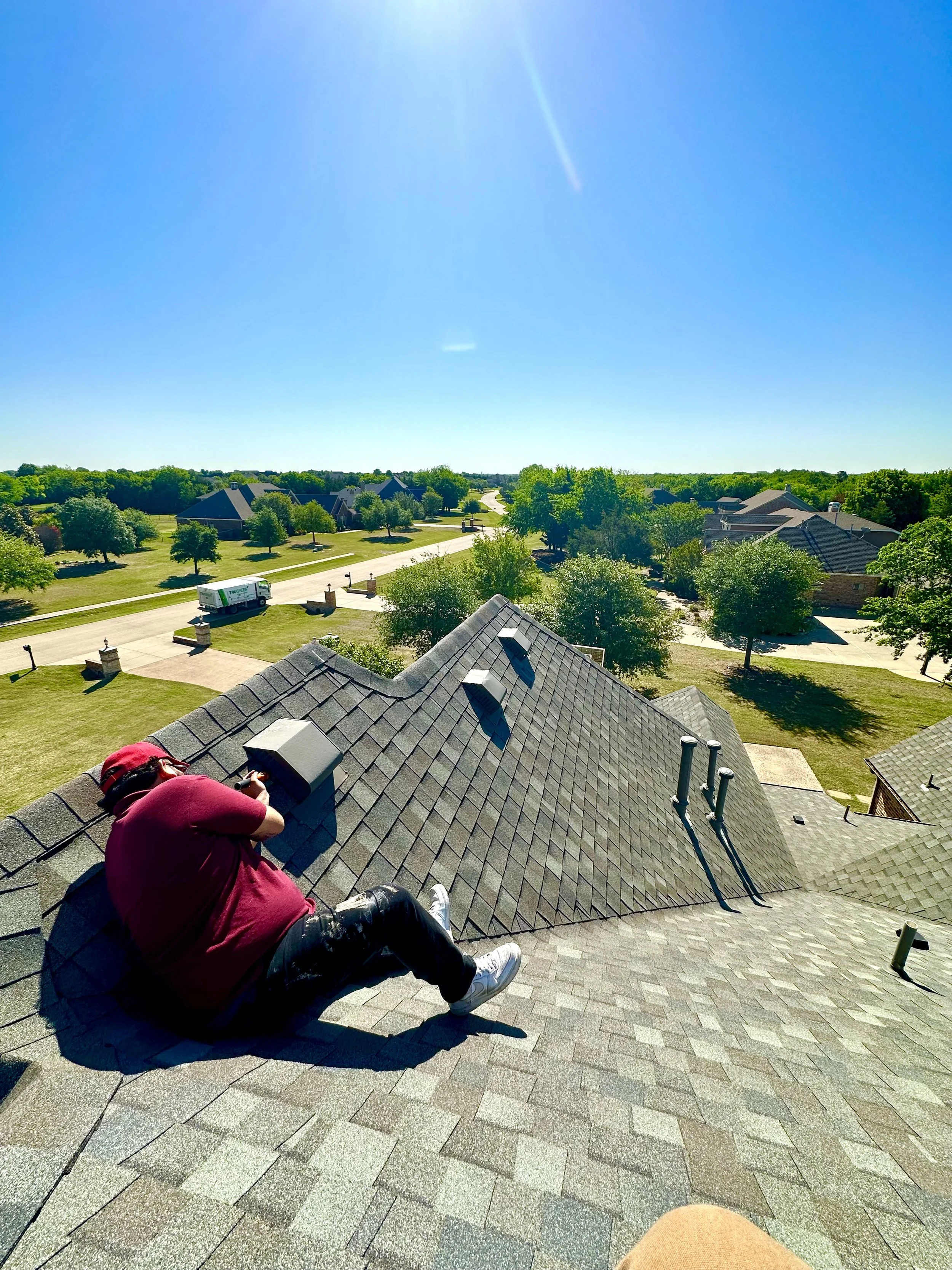 A wildlife control and removal company technician performing rodent exclusion services at a jobsite