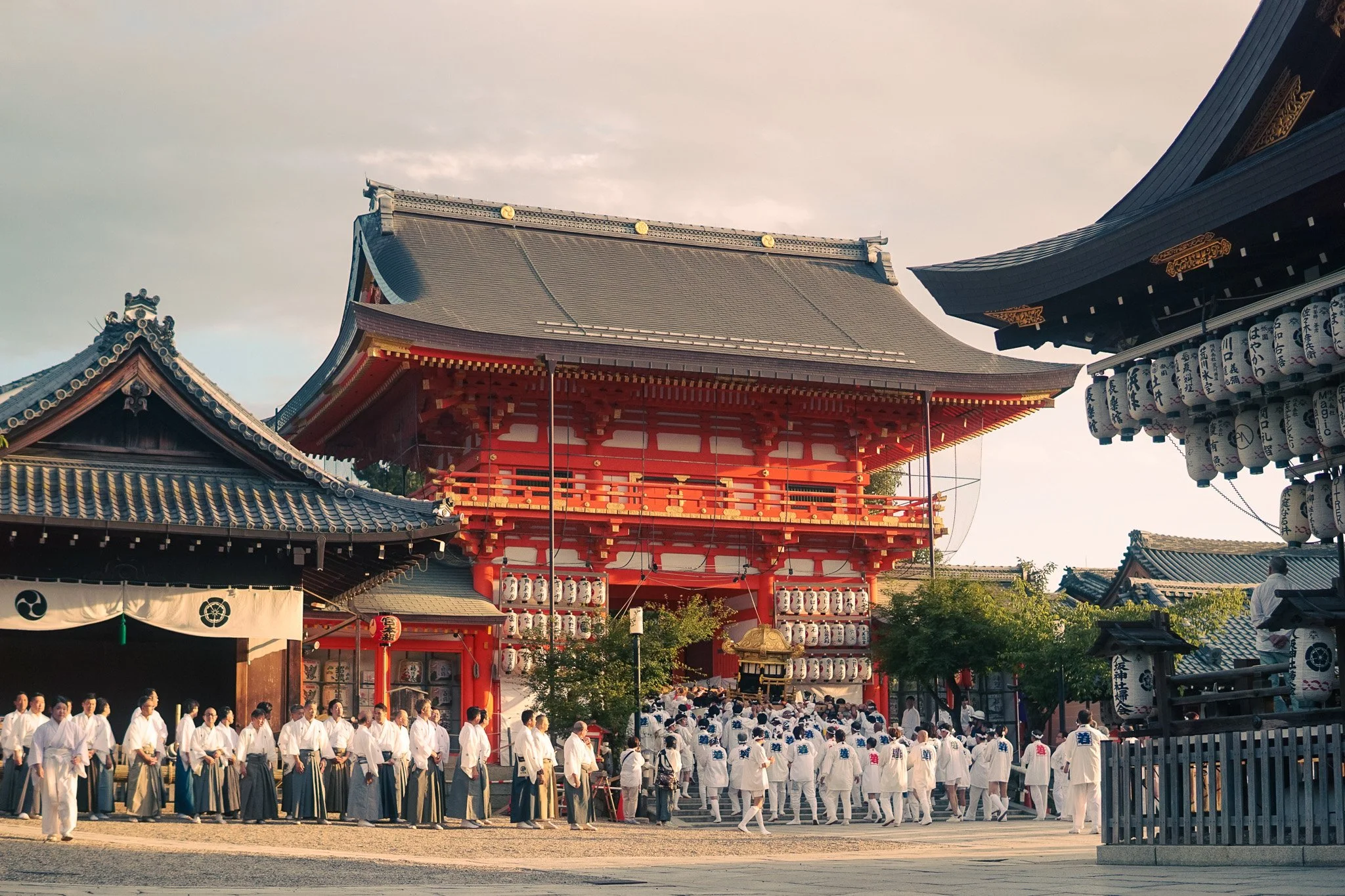 Crowds gathering near Yasaka Shrine during Kyoto summer festival.