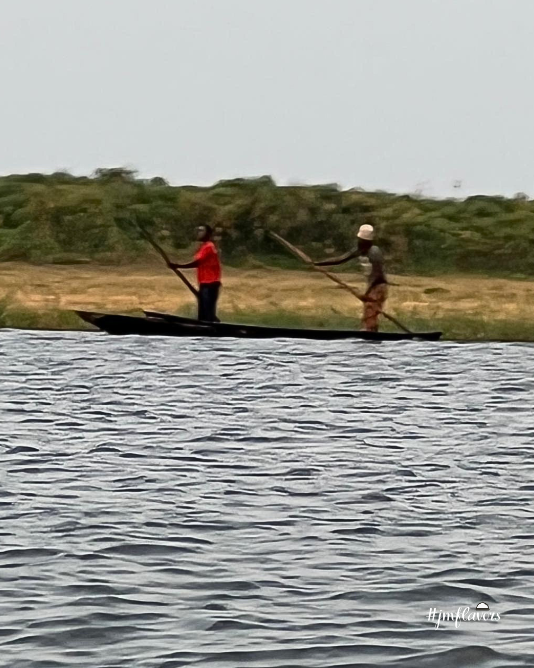 men in shallow canoe (1).png