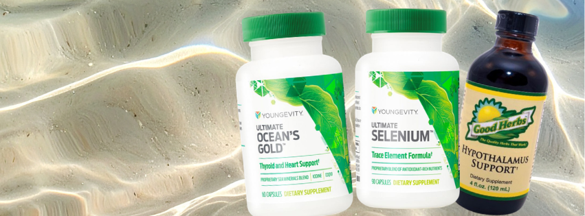 Three bottles of dietary supplements on a sandy surface with water ripples in the background. The first two bottles are from Younggevity, labeled 'Ocean's Gold' and 'Selenium'; the third bottle is labeled 'Good Herbs' with 'Hypothalamos Support'.