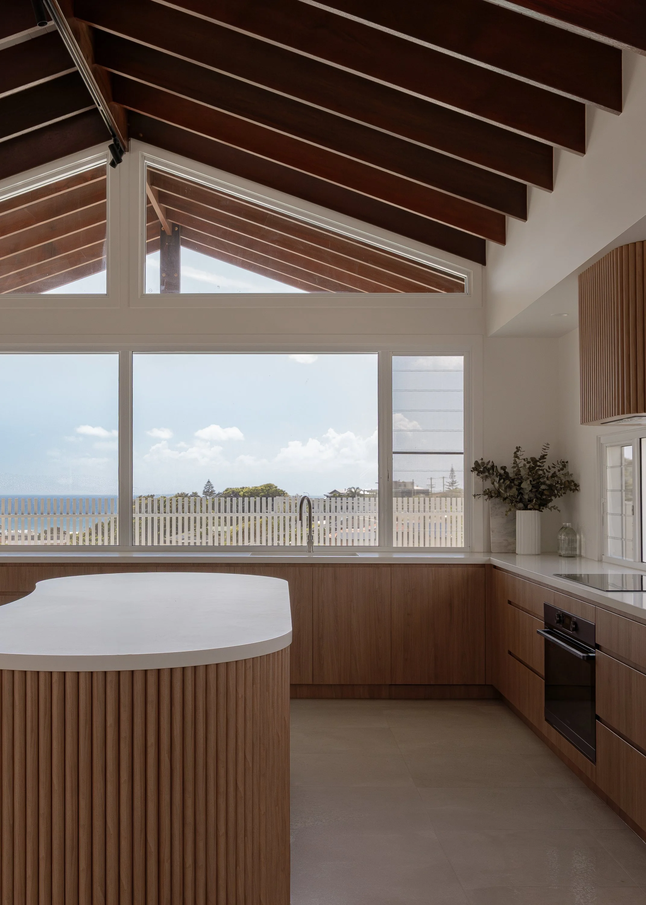 oceanview kitchen with pitched ceiling - featuring polytec