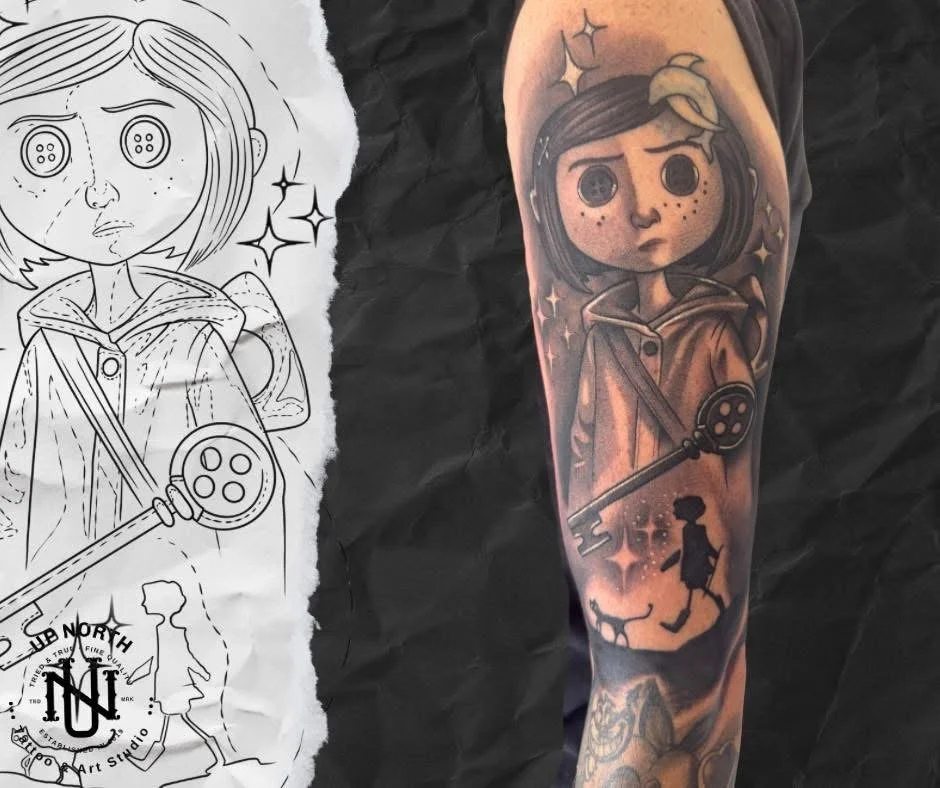 Color tattoo of a girl with dark hair, freckles, and a serious expression, holding a large key, with a small girl, a cat, and sparkles around her, matching the black and white sketch.