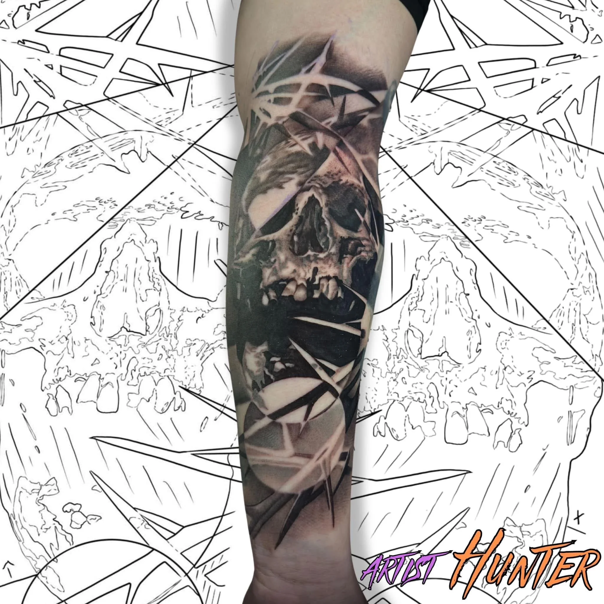 Tattooed arm featuring a skull design against a hand-drawn map background with text reading 'Artist Turned'.