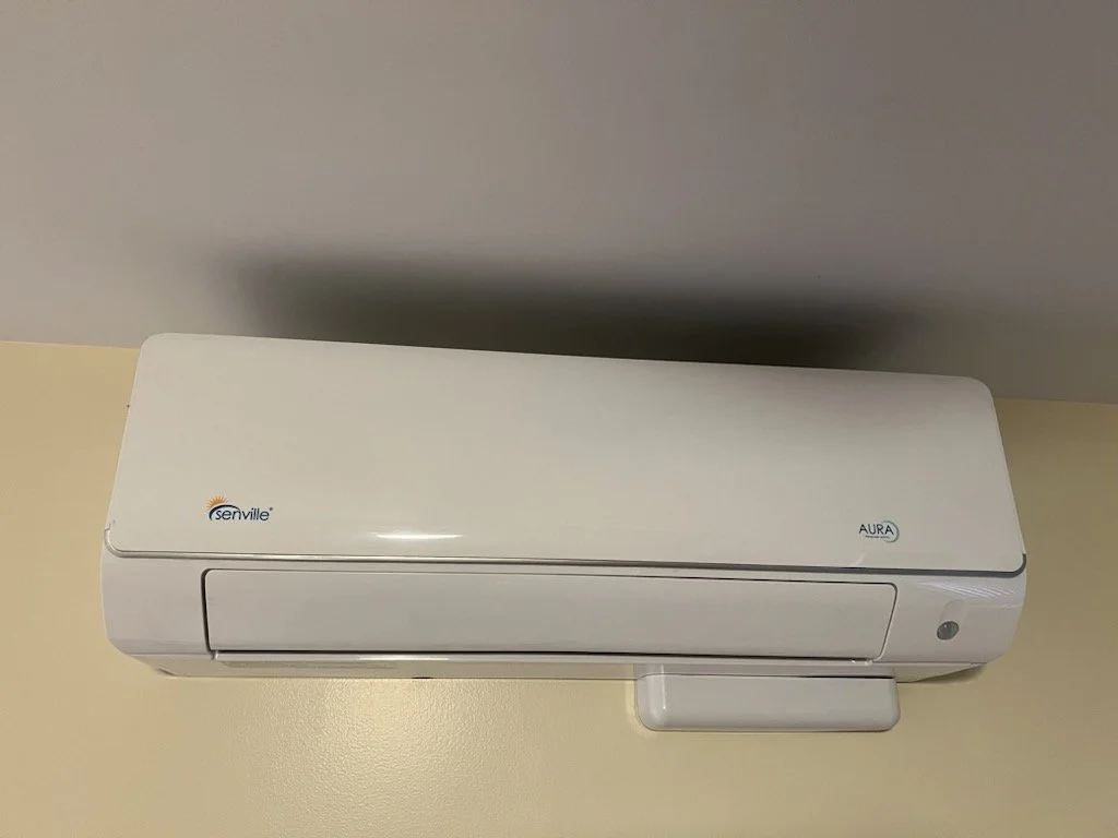 White split air conditioner mounted on a wall
