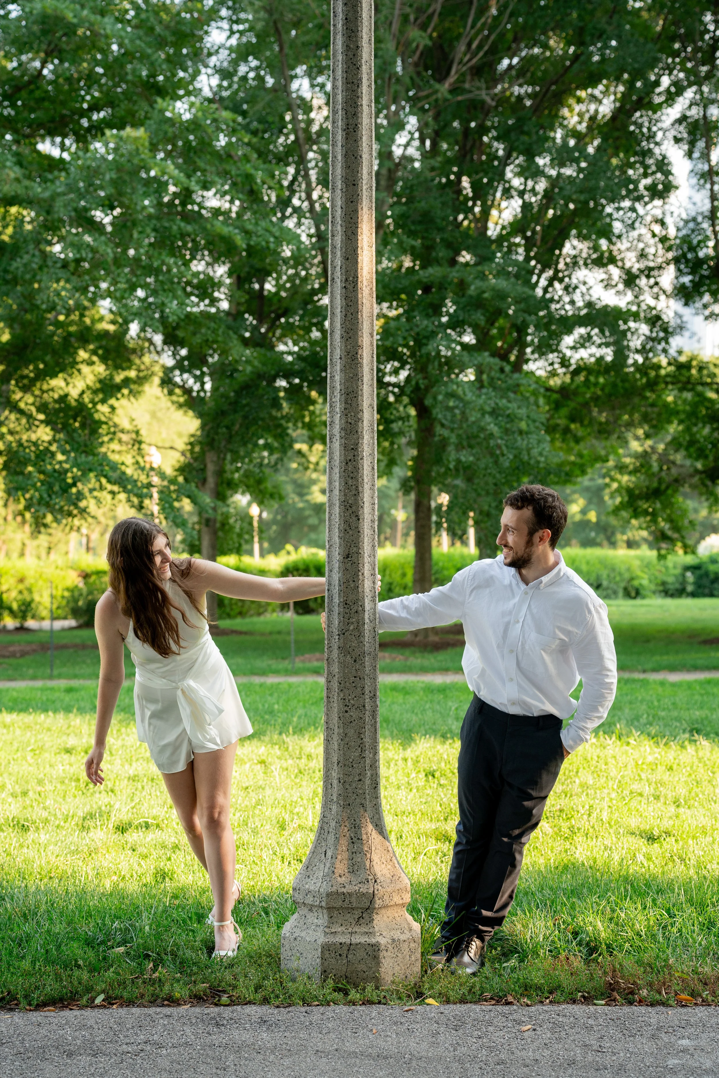 A candid downtown couple photo capturing movement, laughter, and natural chemistry during an engagement session.