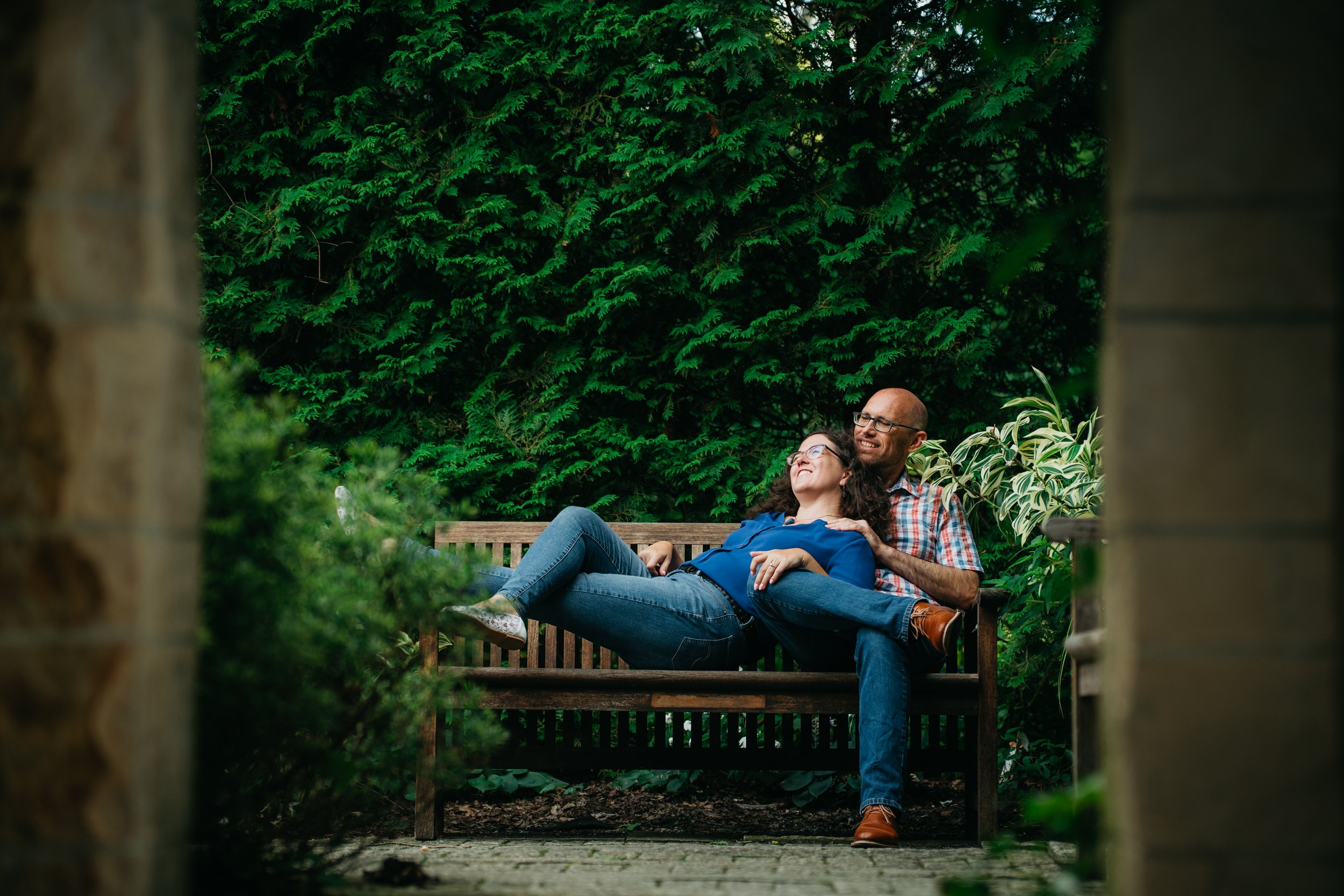 A candid engagement moment capturing real laughter, movement, and the natural chemistry between the couple.