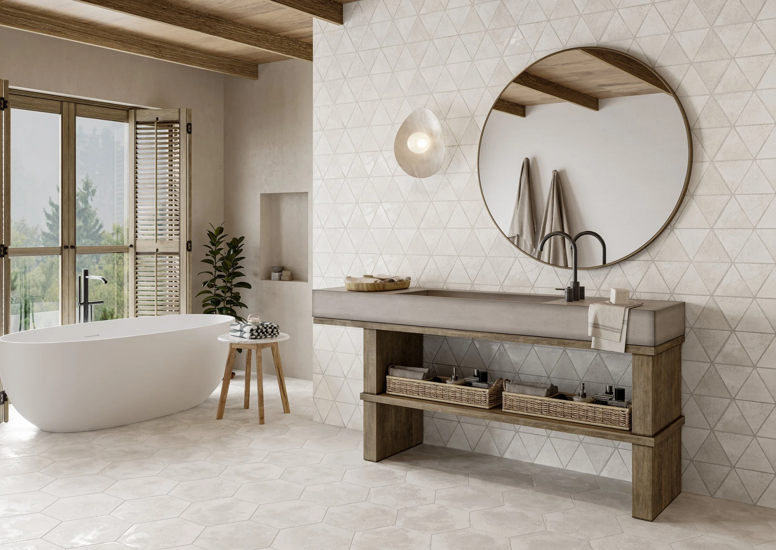 Une salle de bain moderne avec une baignoire balnéo, un miroir rond, une vasque en béton, un meuble en bois avec des paniers de rangement et un mur décoré de carreaux géométriques.