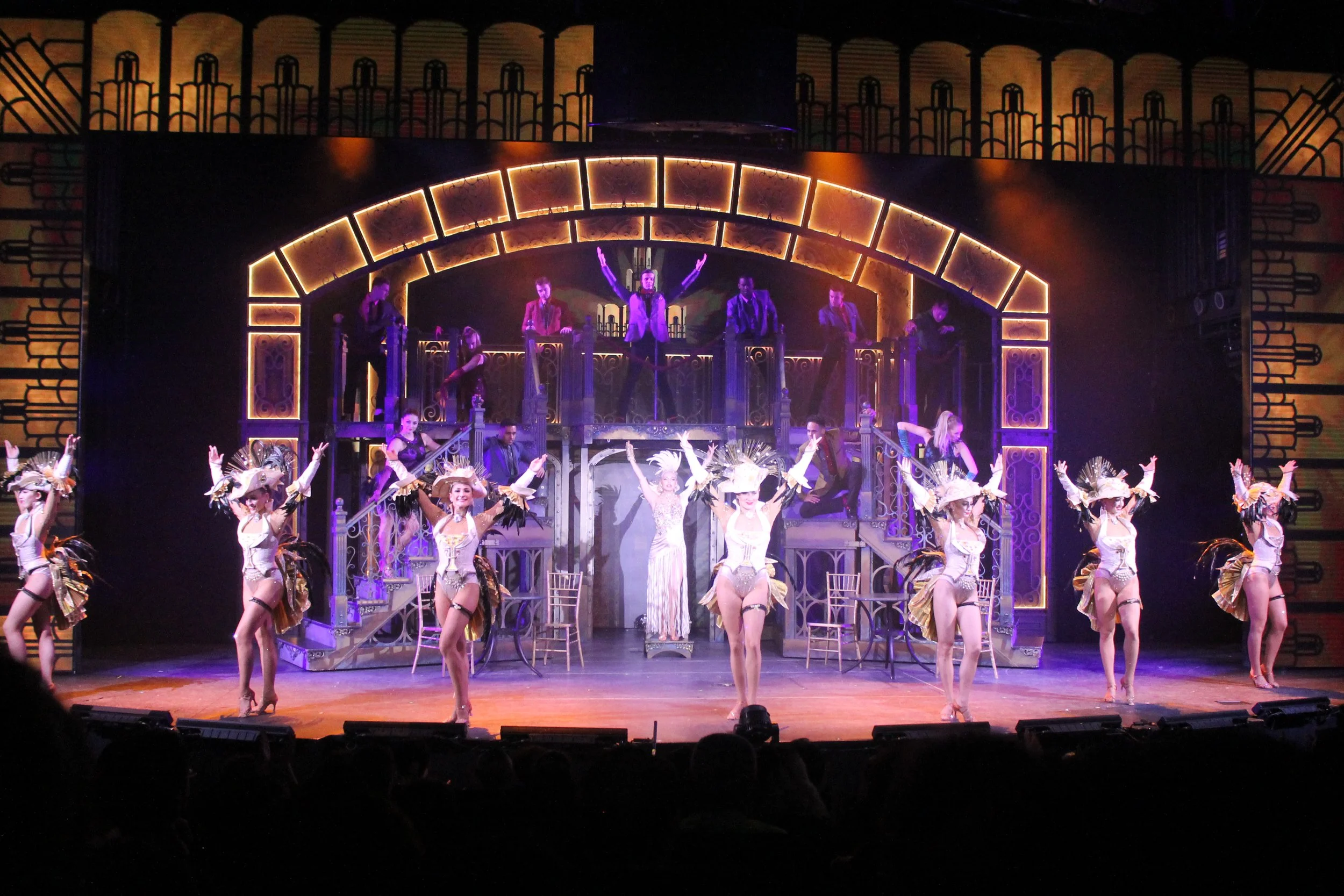 Professional showgirls grace the stage.
